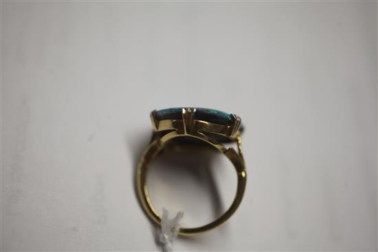 An 18ct gold and platinum set oval black opal dress ring, size L.